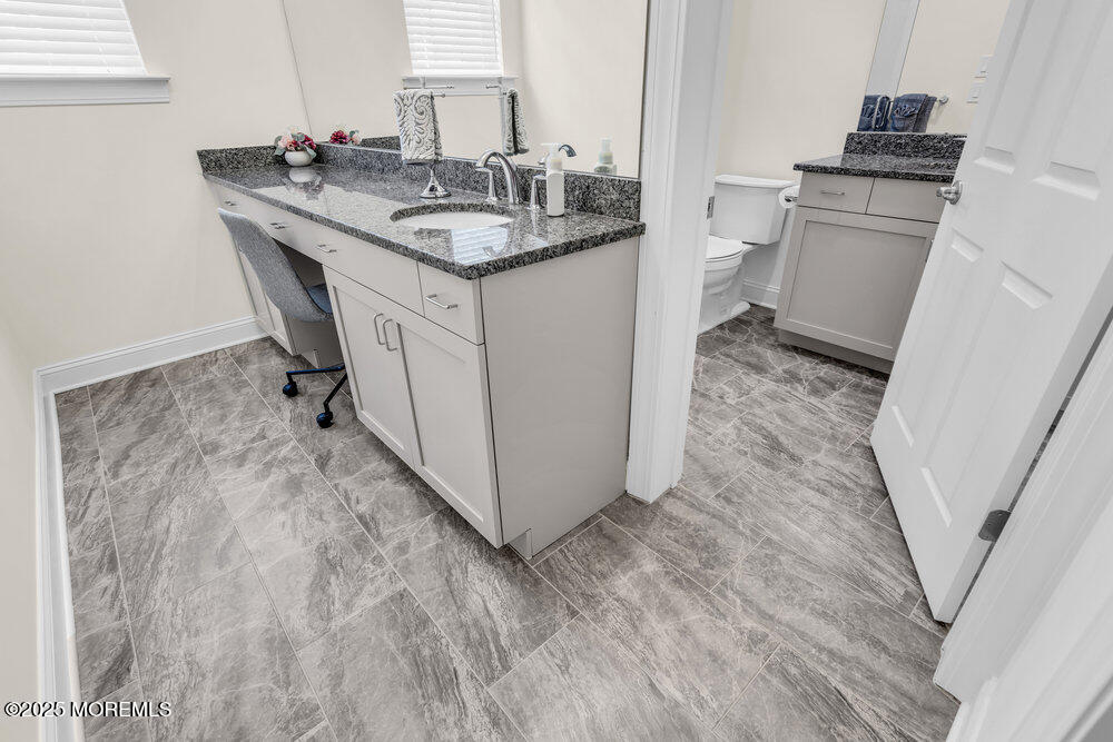 65 Moonlight Drive Barnegat, NJ 08005 - Photo 28 of 68 a bathroom with a sink and a toilet