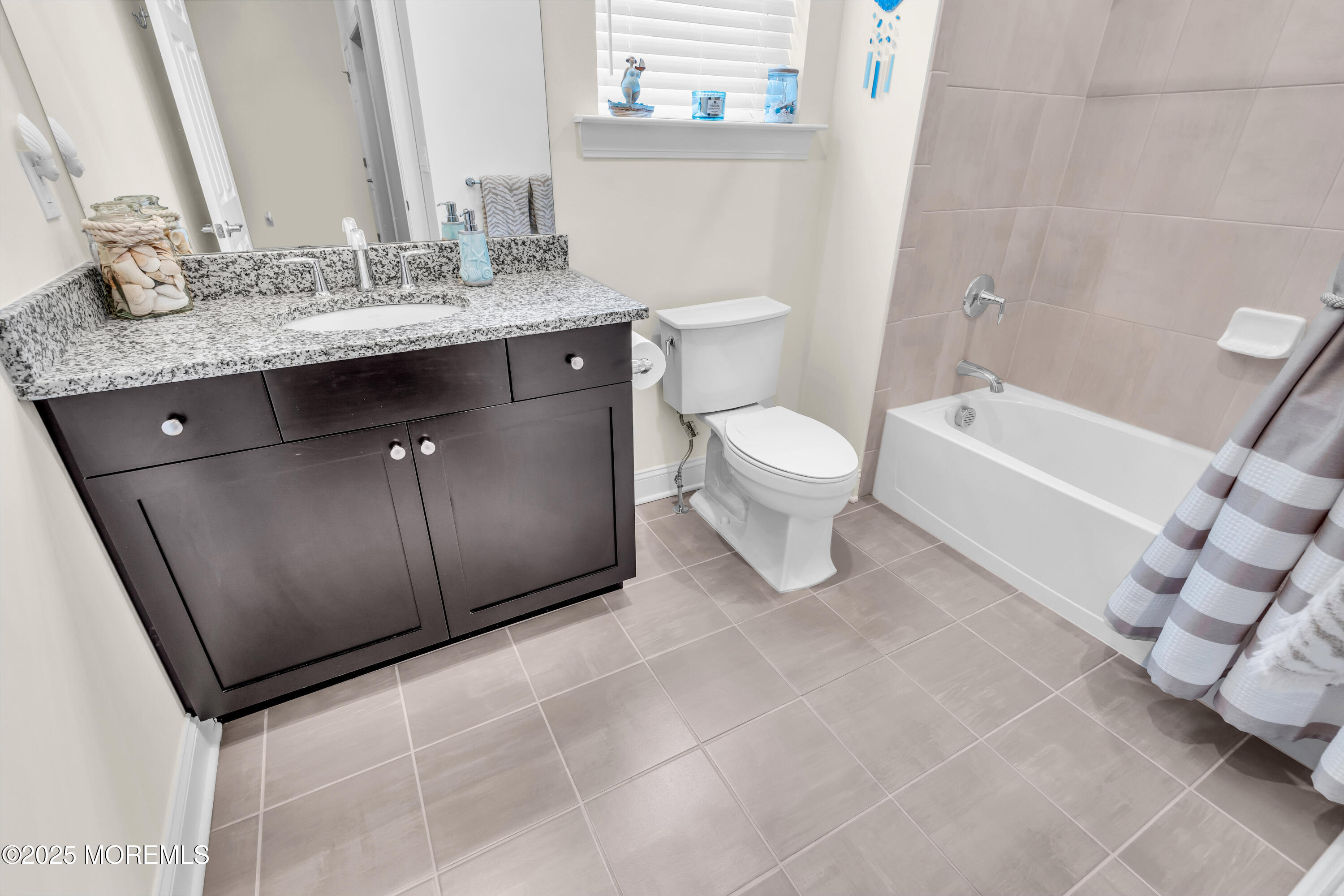 65 Moonlight Drive Barnegat, NJ 08005 - Photo 40 of 68 a bathroom with a granite countertop sink a toilet and bathtub