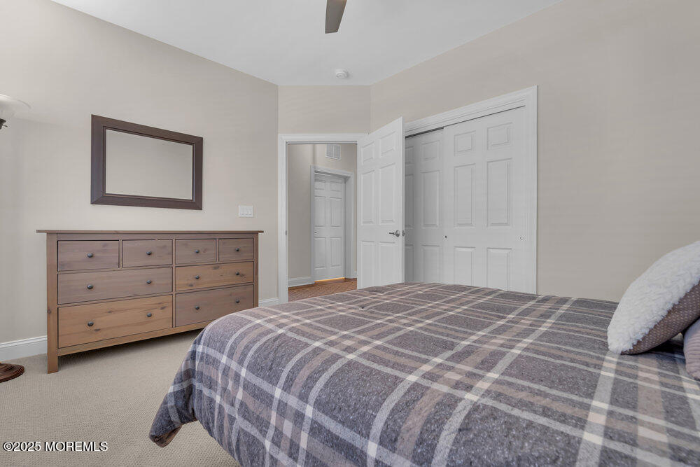 65 Moonlight Drive Barnegat, NJ 08005 - Photo 42 of 68 a bedroom with a bed and a dresser