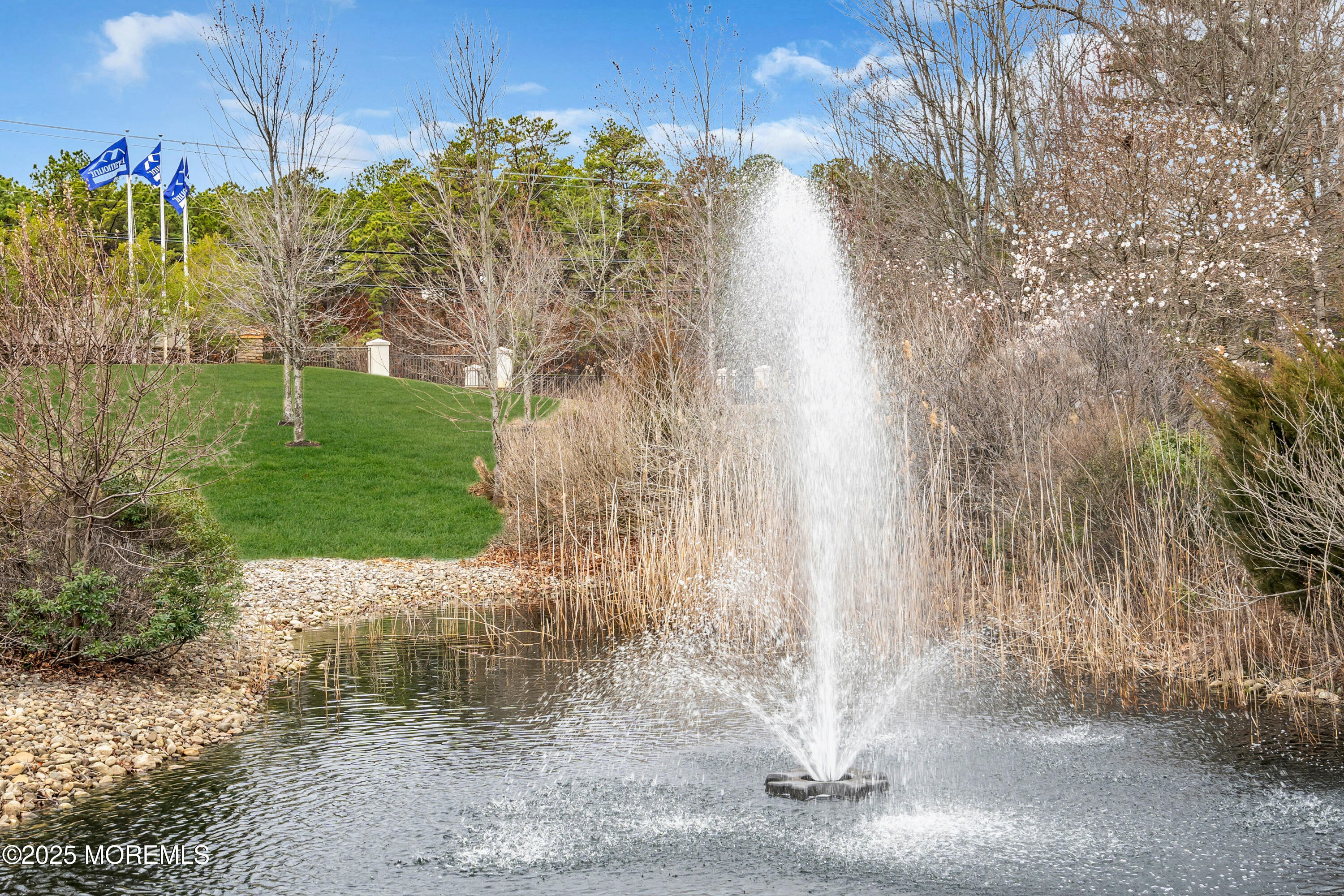 65 Moonlight Drive Barnegat, NJ 08005 - Photo 50 of 68 a view of a yard with plants and a bench