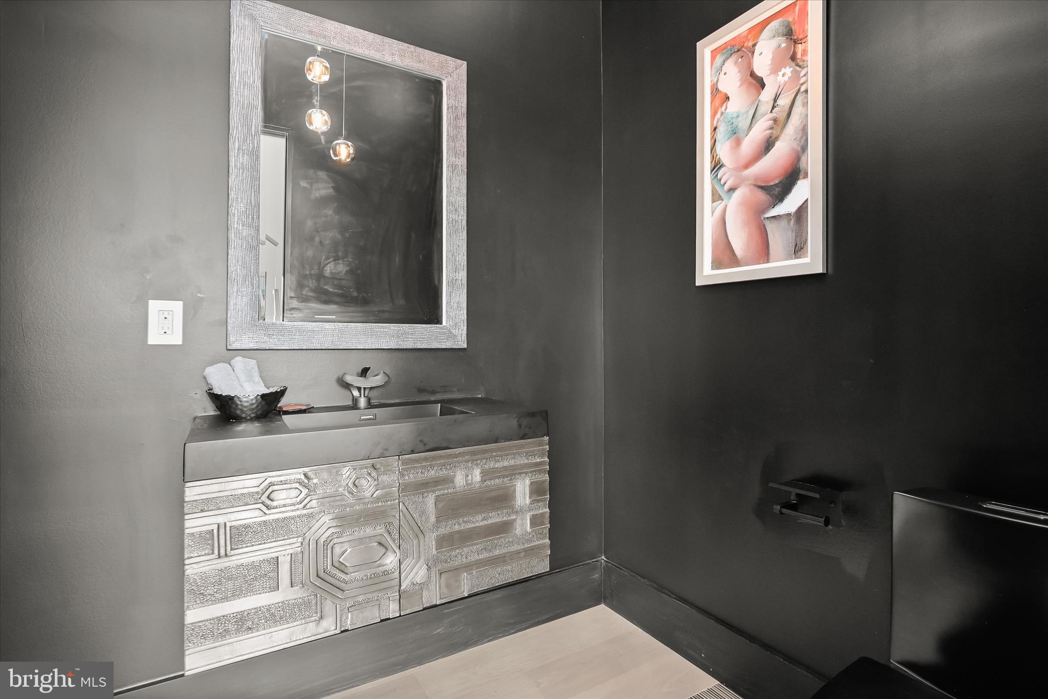 4509 Foxhall Crescent Northwest Washington, DC 20007 - Photo 14 of 39 a bathroom with a granite countertop sink a vanity and mirror