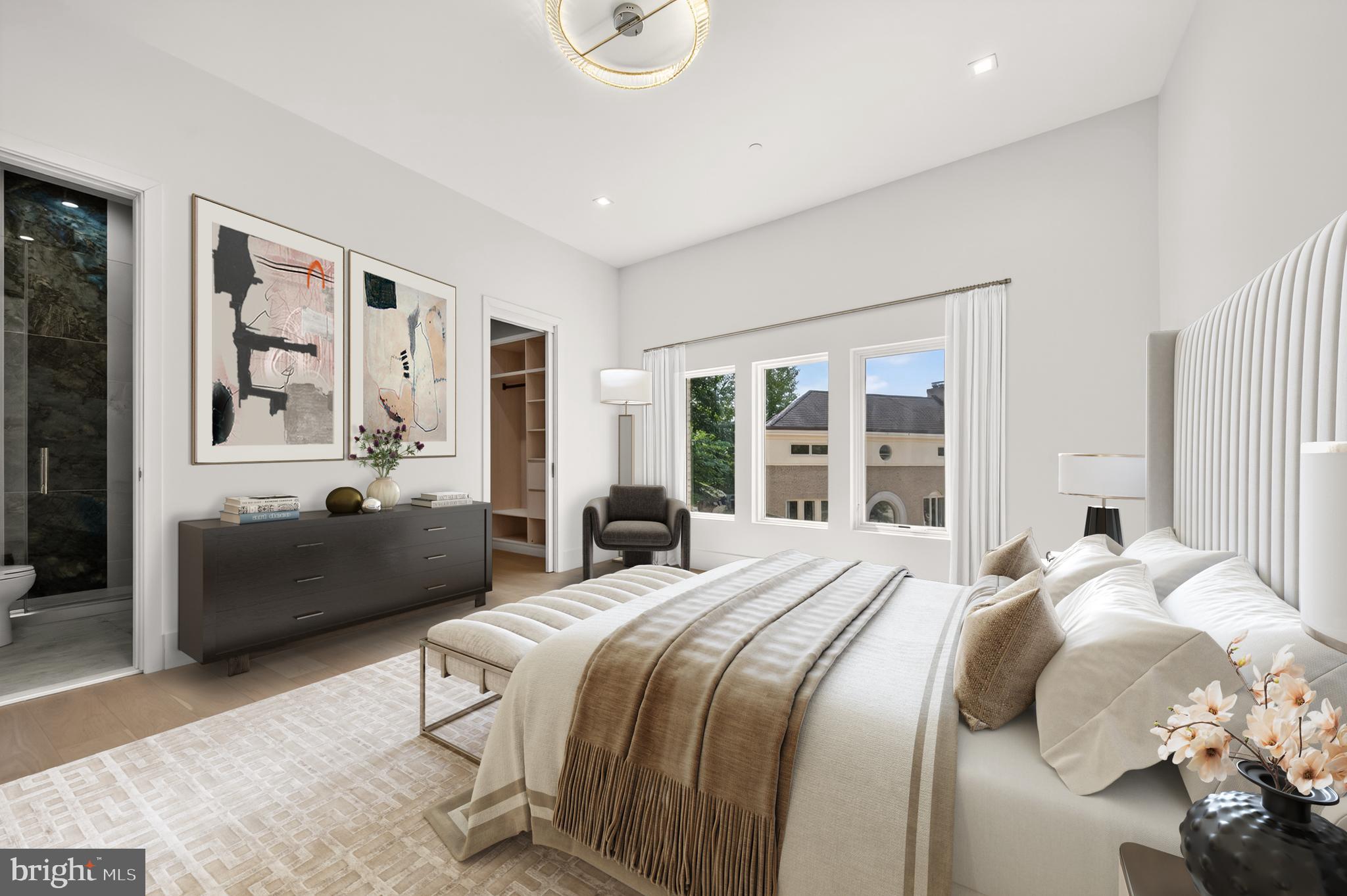 4509 Foxhall Crescent Northwest Washington, DC 20007 - Photo 15 of 39 a bedroom with a bed couch and a large window