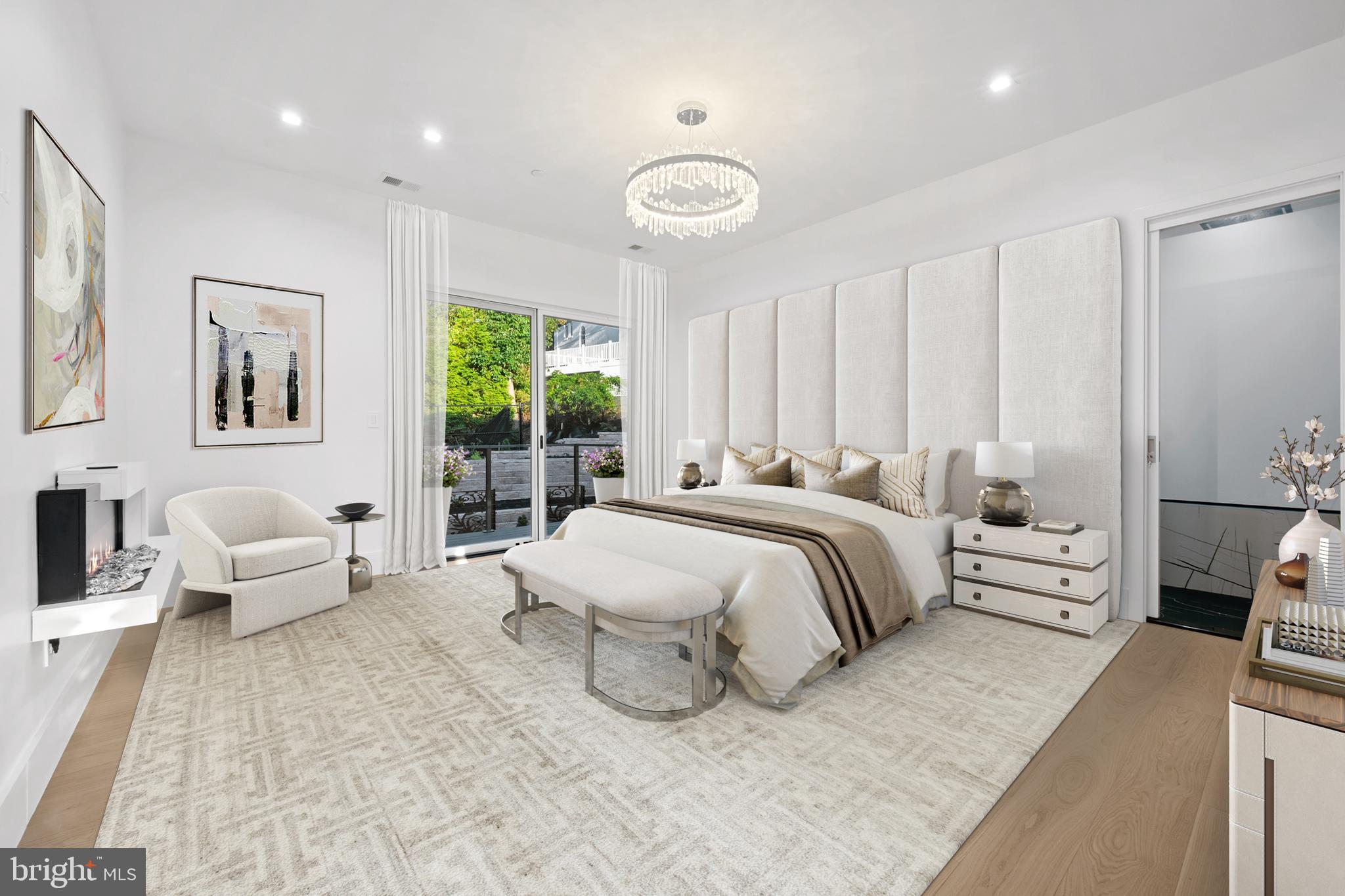 4509 Foxhall Crescent Northwest Washington, DC 20007 - Photo 16 of 39 a spacious bedroom with a bed and a couch