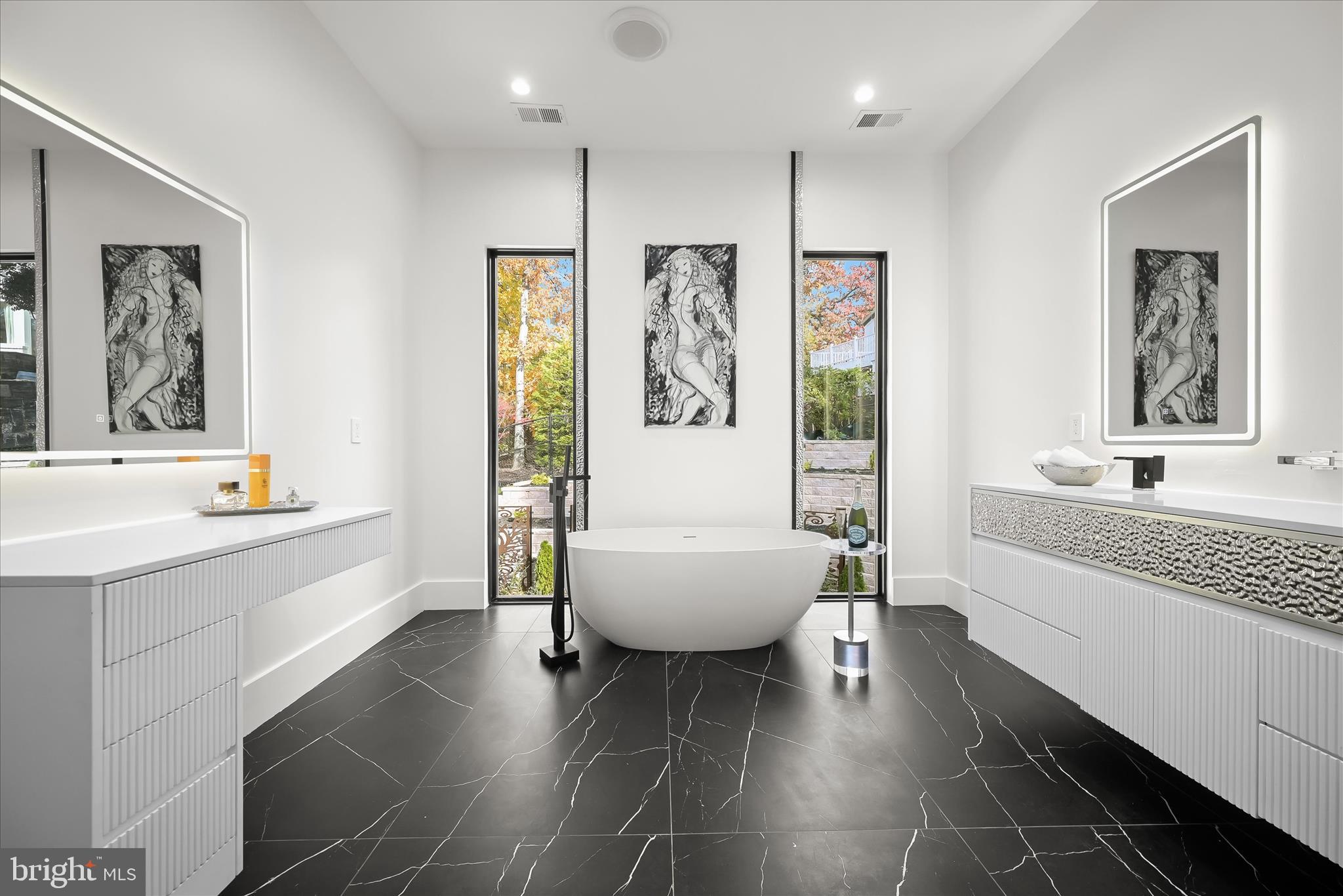 4509 Foxhall Crescent Northwest Washington, DC 20007 - Photo 19 of 39 a spacious bathroom with a large tub sink and glass door
