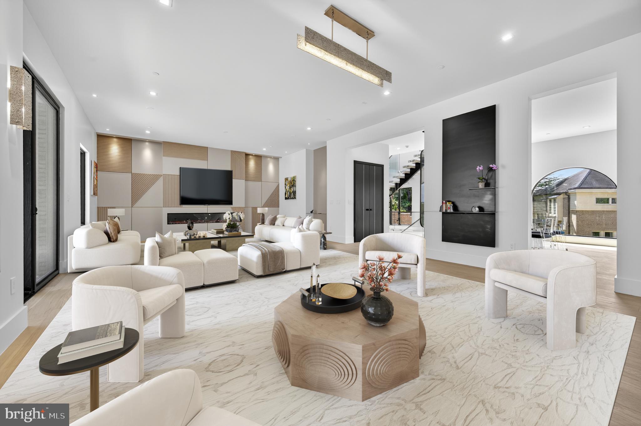 4509 Foxhall Crescent Northwest Washington, DC 20007 - Photo 2 of 39 a living room with furniture and a flat screen tv