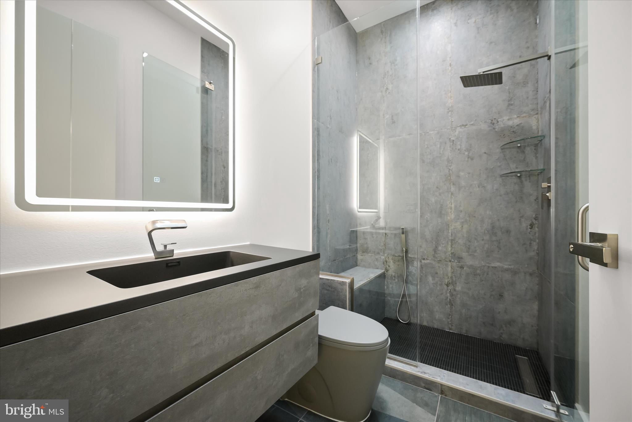 4509 Foxhall Crescent Northwest Washington, DC 20007 - Photo 26 of 39 a bathroom with a sink and a mirror