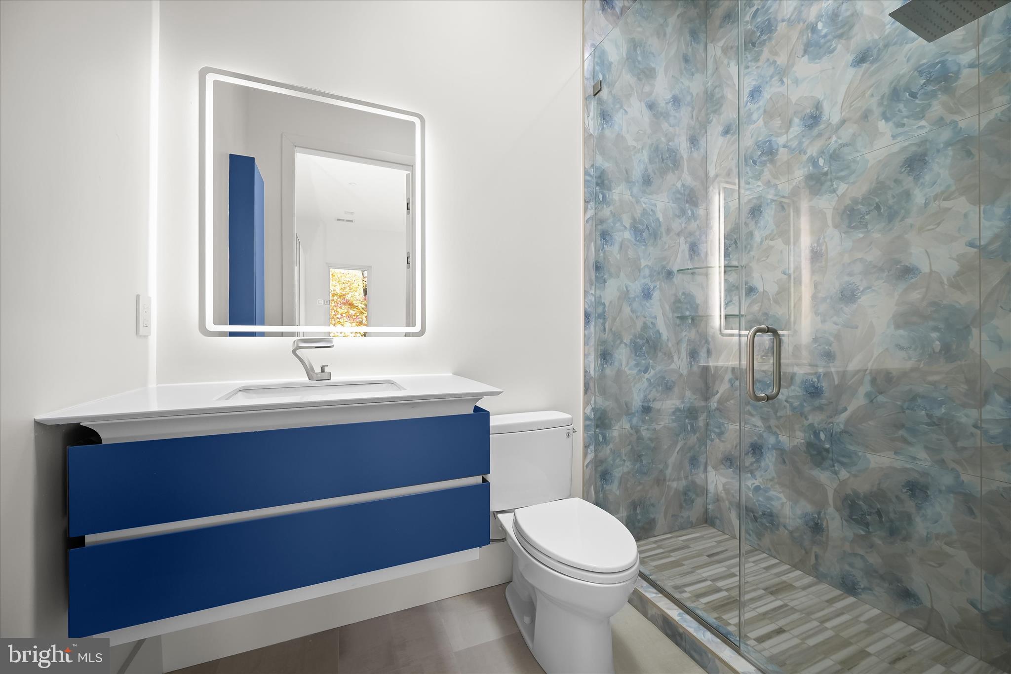 4509 Foxhall Crescent Northwest Washington, DC 20007 - Photo 28 of 39 a bathroom with a sink mirror vanity and toilet