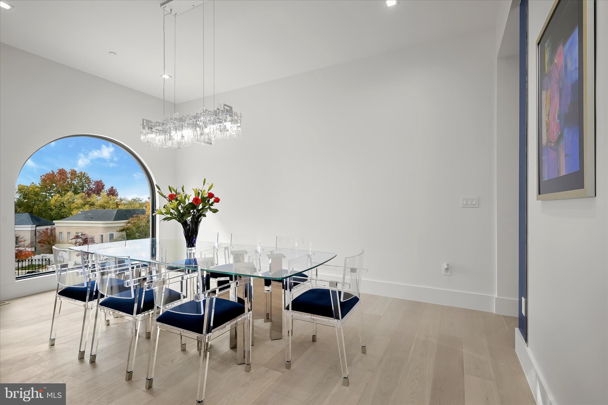 4509 Foxhall Crescent Northwest Washington, DC 20007 - Photo 7 of 39 a view of a dining room with furniture and chandelier