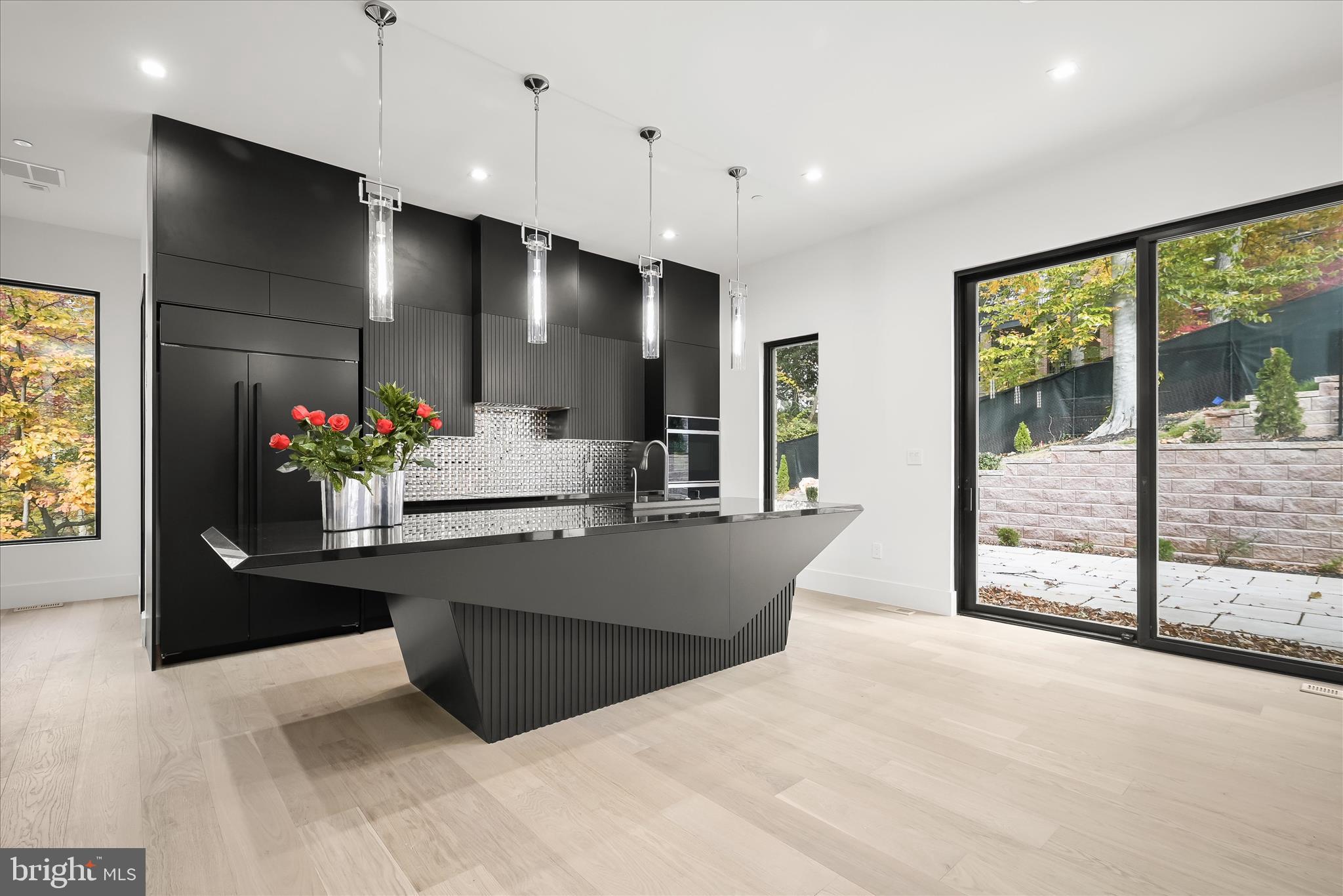 4509 Foxhall Crescent Northwest Washington, DC 20007 - Photo 10 of 39 a living room with kitchen island granite countertop furniture and a flat screen tv