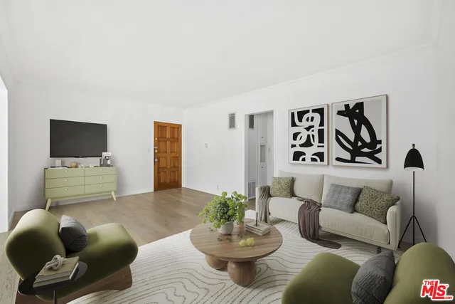 a living room with furniture and white walls