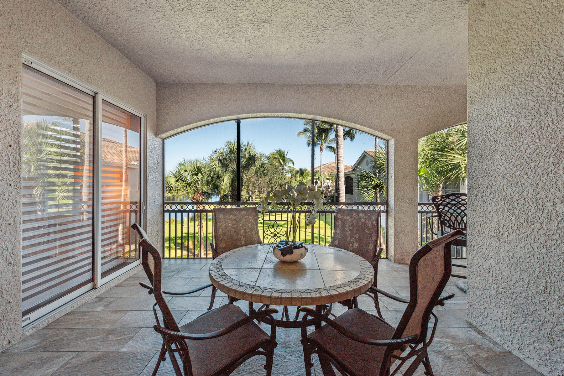 3189 Aviamar Circle, Unit 202 Naples, FL 34114 - Photo 24 of 50 a view of a dining room with furniture window and outside view