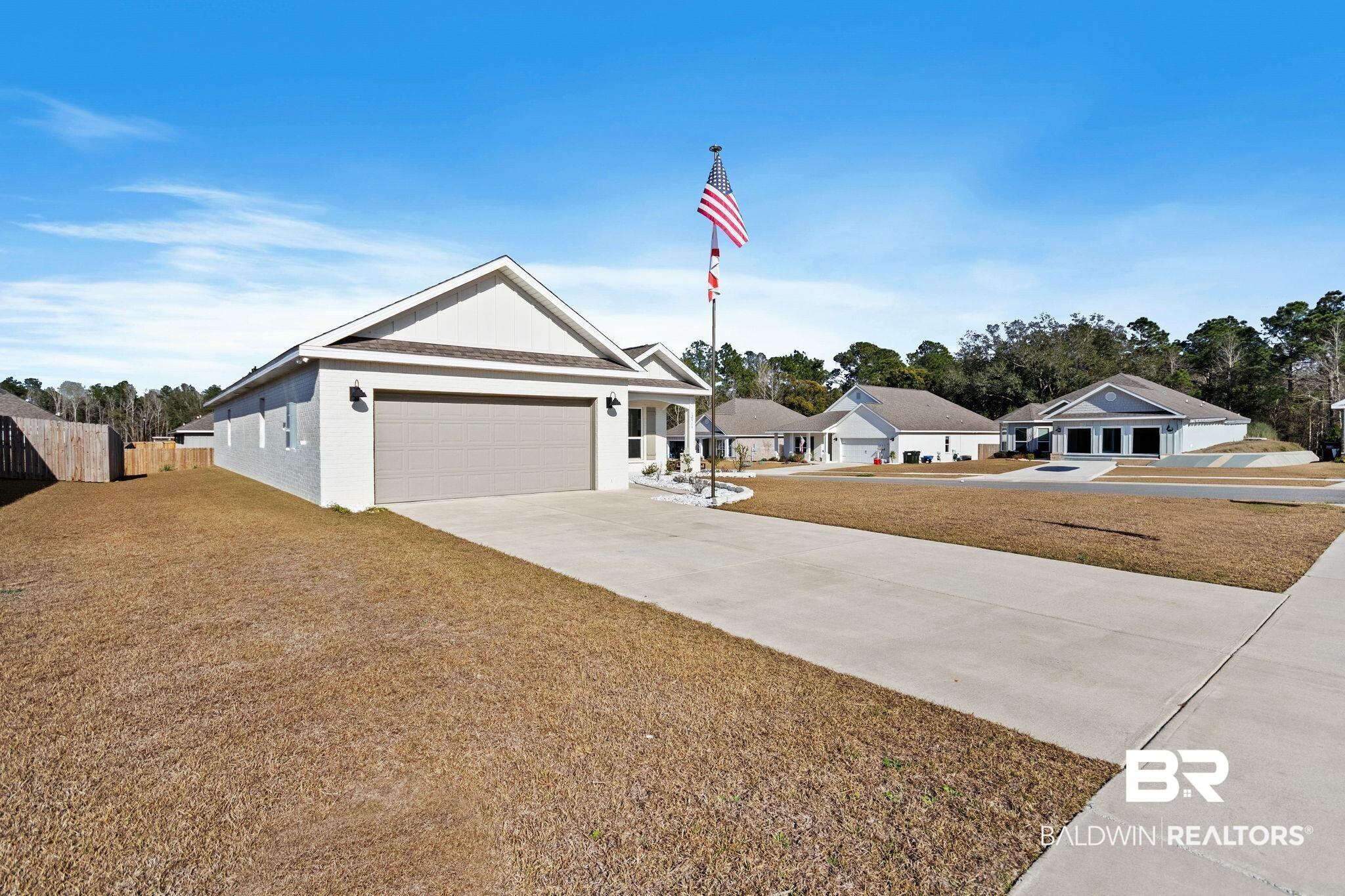 12919 Torrent Road Fairhope, AL 36532 - Photo 7 of 74 Single story home featuring concrete driveway and an attached garage