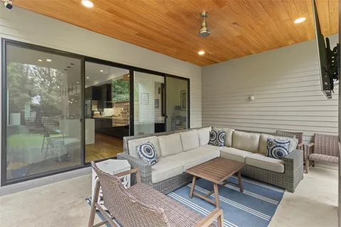 a outdoor living space with furniture and a potted plant