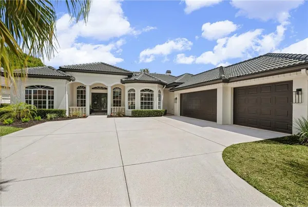 a front view of a house with a garden and entryway