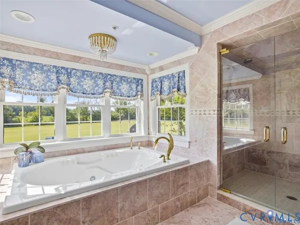 a bathroom with a granite countertop sink a mirror and a shower