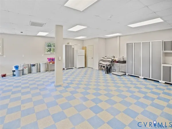 an aerial view of a house with a yard basket ball court and outdoor seating