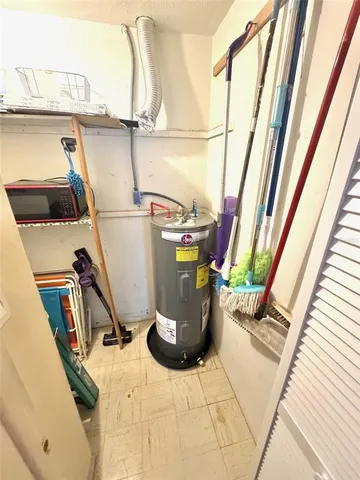 a view of storage and utility room with a sink