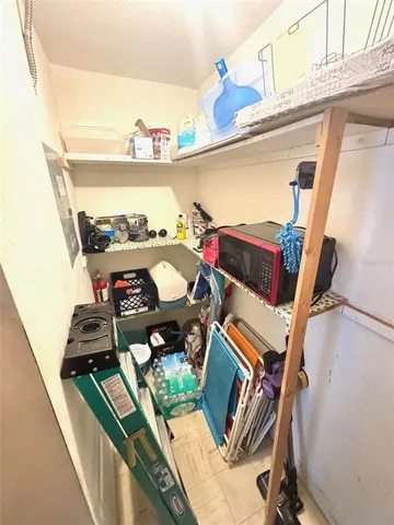 a view of living room with furniture and floor to ceiling window