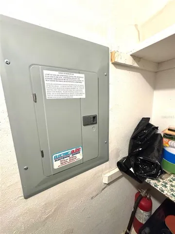 a bedroom with a bed and a mirror