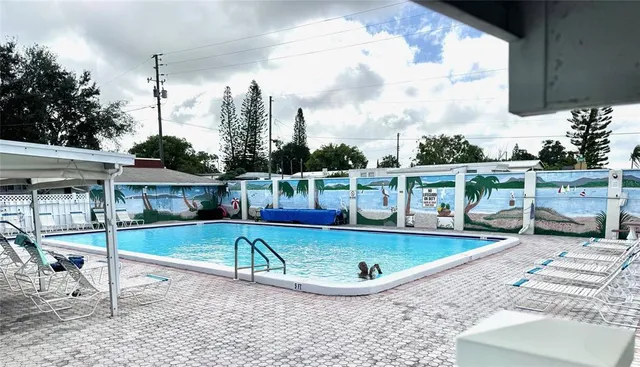 a view of a swimming pool with a patio