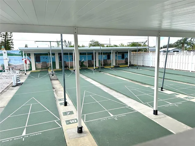 a view of a swimming pool with outdoor seating