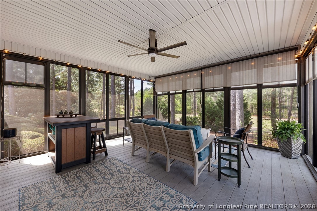 30180 East Lake Road Wagram, NC 28396 - Photo 4 of 42 a view of a dining room with furniture window and wooden floor