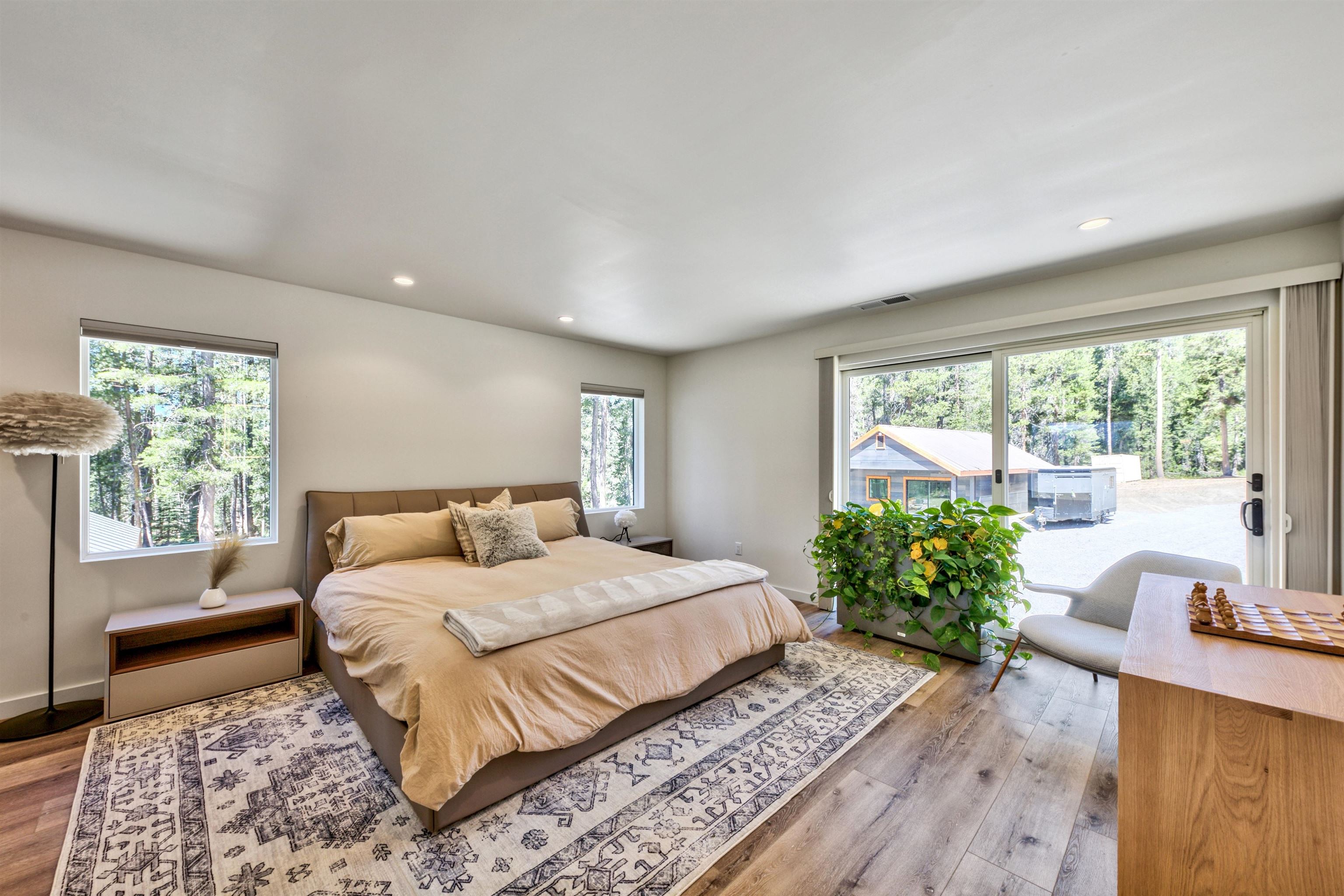 804 Fiberboard Road Sierraville, CA 96126 - Photo 10 of 28 a bedroom with a large bed and a large window