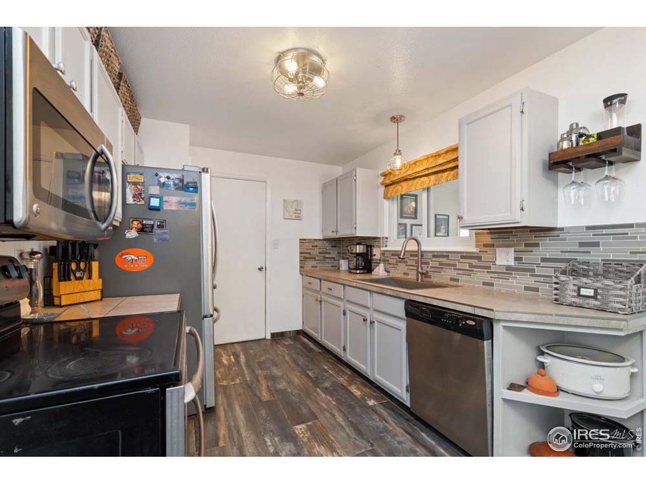 Updated kitchen with tile floors and counter tops
