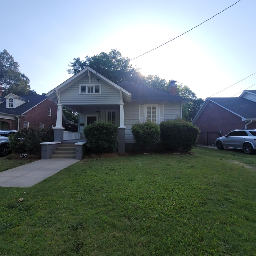 a house view with a garden space