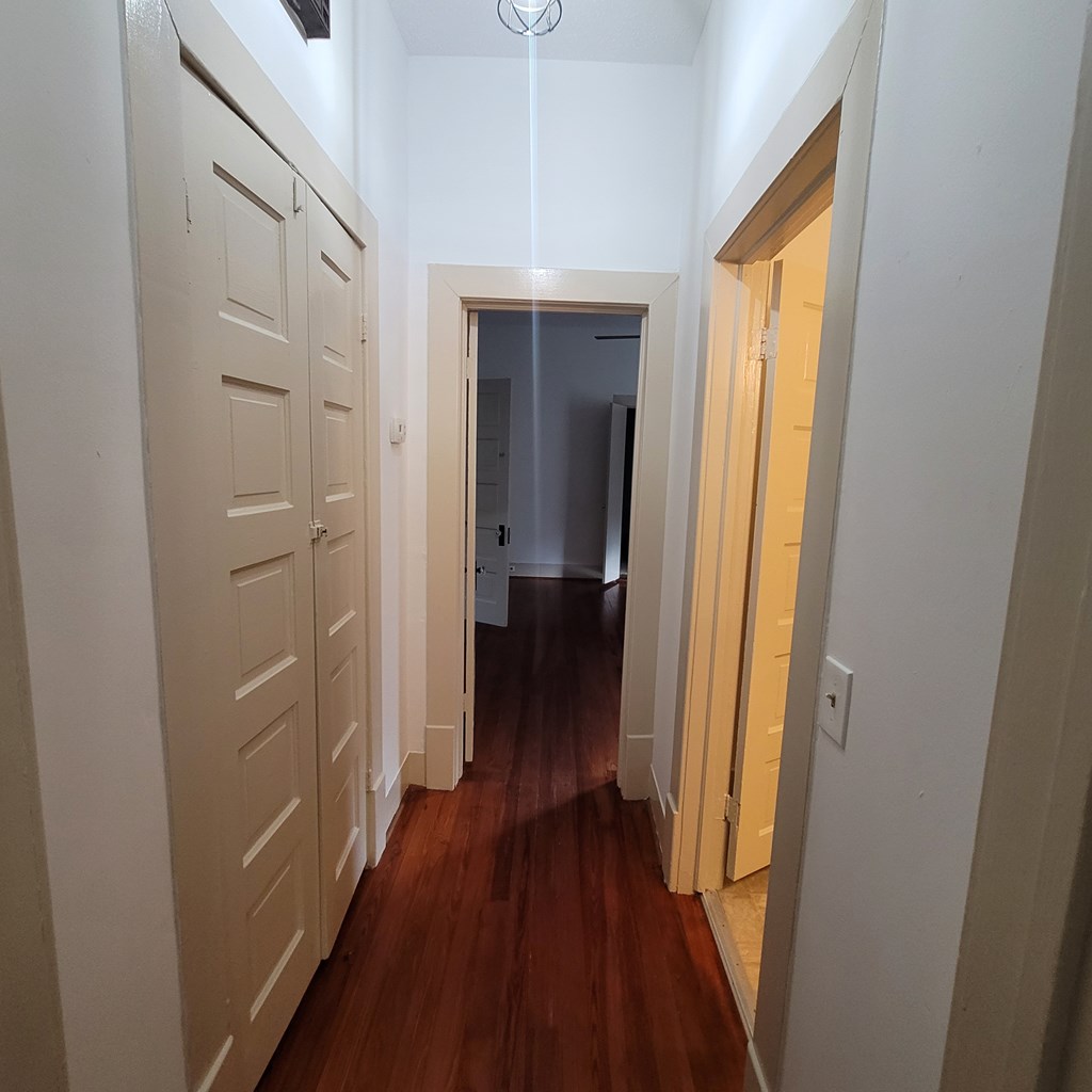 1277 Eberhart Avenue Columbus, GA 31906 - Photo 14 of 17 a view of a hallway with wooden floor and closet