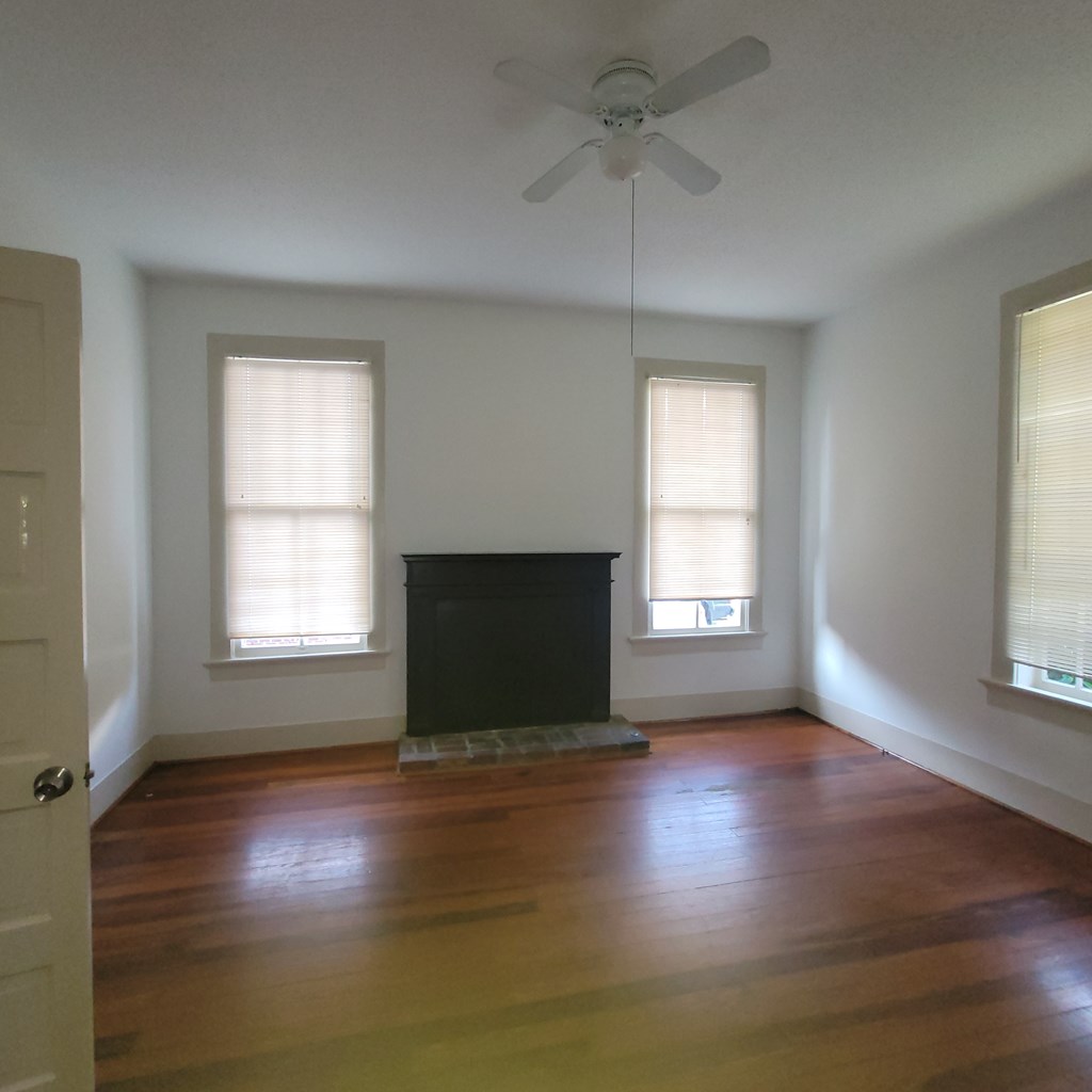1277 Eberhart Avenue Columbus, GA 31906 - Photo 15 of 17 a view of an empty room with wooden floor and a window