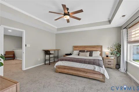 a bedroom with a bed and a table