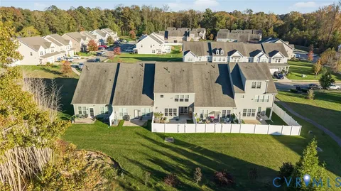 an aerial view of a house with a swimming pool