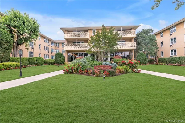 a front view of building with yard