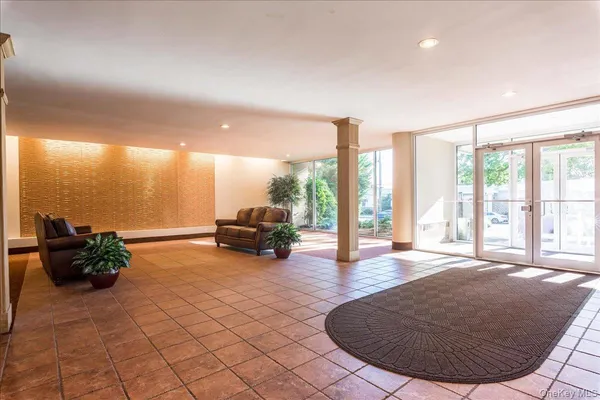 a view of livingroom with furniture and floor to ceiling window