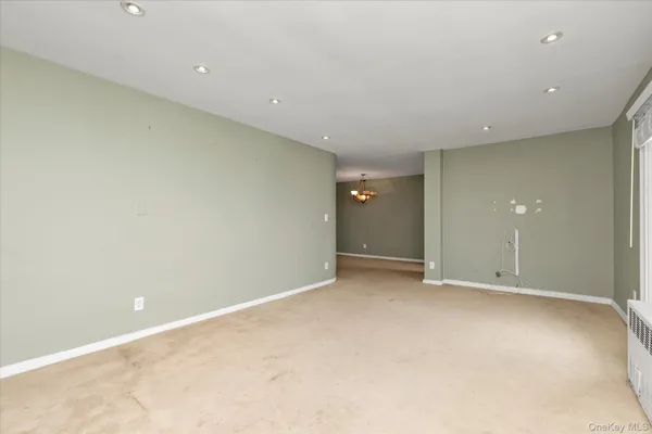 an empty room with closet area
