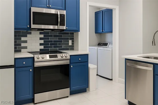 a kitchen with a stove and a microwave