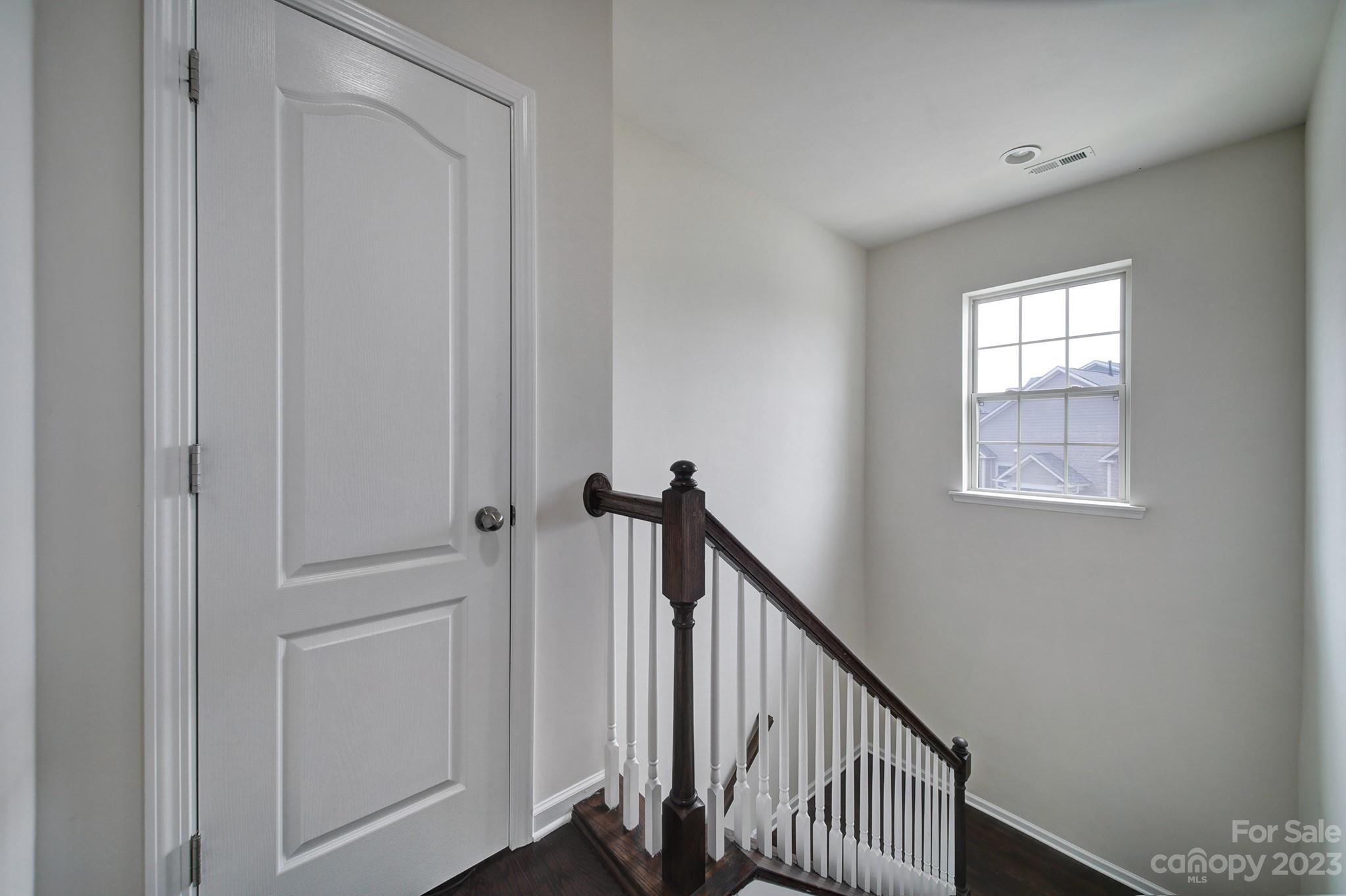 210 Butterfly Place Tega Cay, SC 29708 - Photo 27 of 40 a view of a hallway with window
