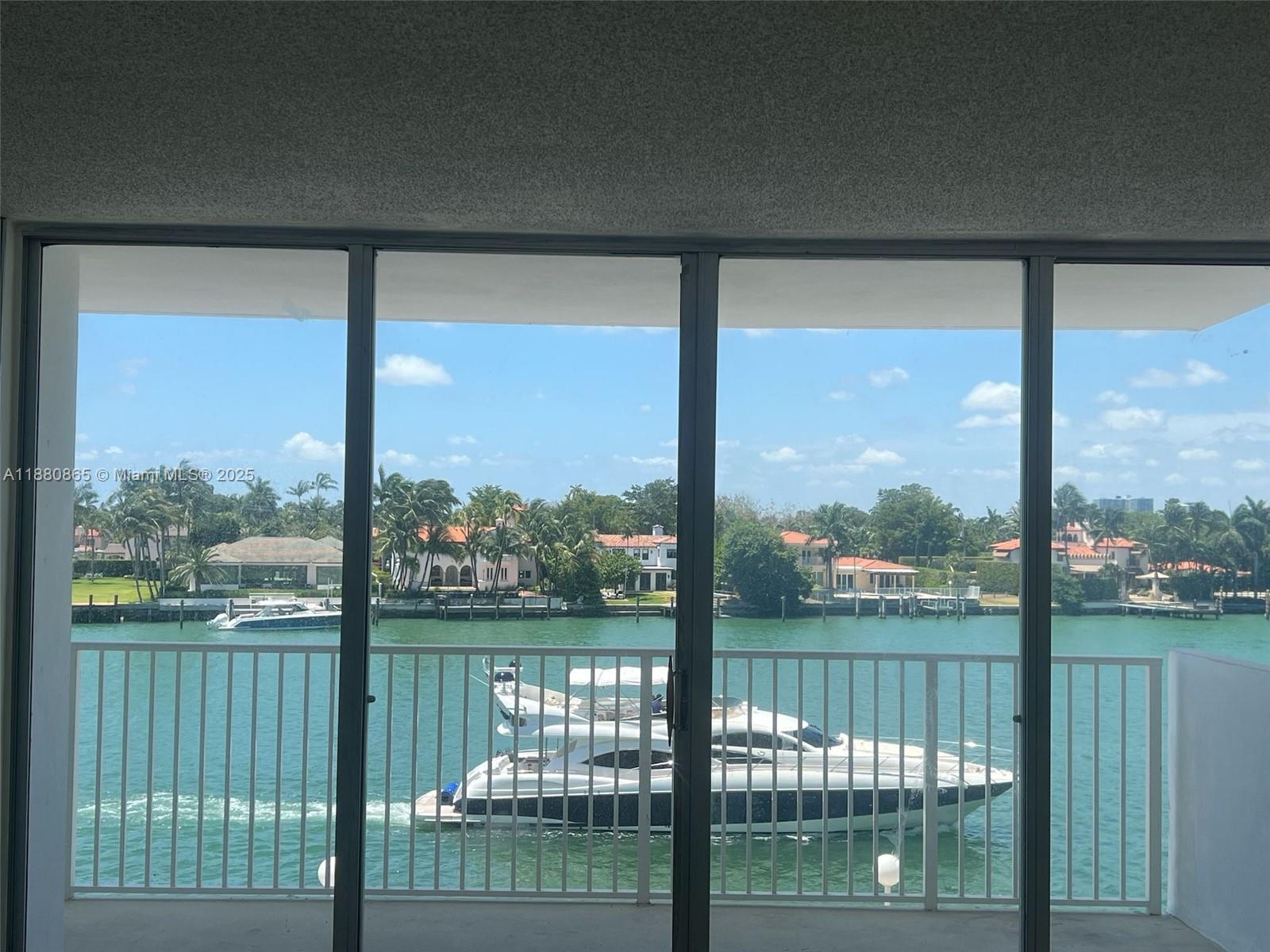 5838 Collins Avenue, Unit 2A Miami Beach, FL 33140 - Photo 1 of 14 a view of outdoor with green space