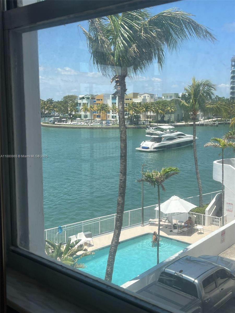 5838 Collins Avenue, Unit 2A Miami Beach, FL 33140 - Photo 12 of 14 a view of a lake from a window