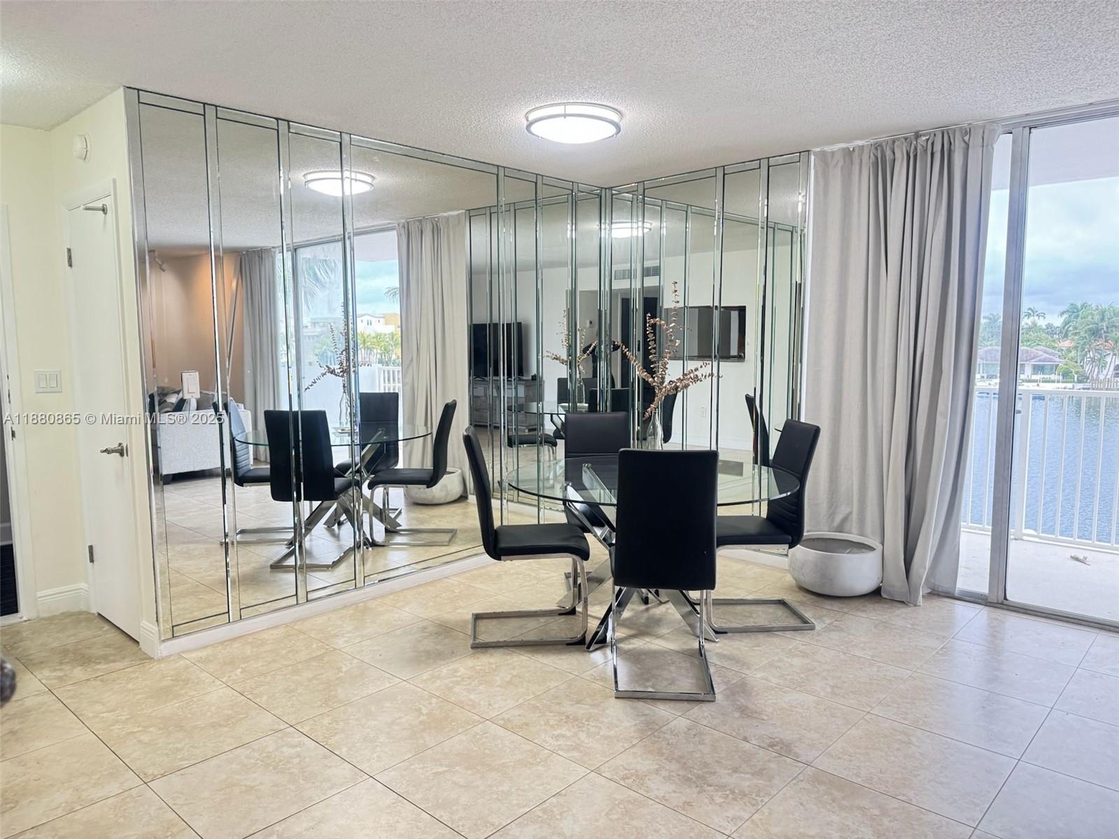 5838 Collins Avenue, Unit 2A Miami Beach, FL 33140 - Photo 6 of 14 a view of a room with gym equipment