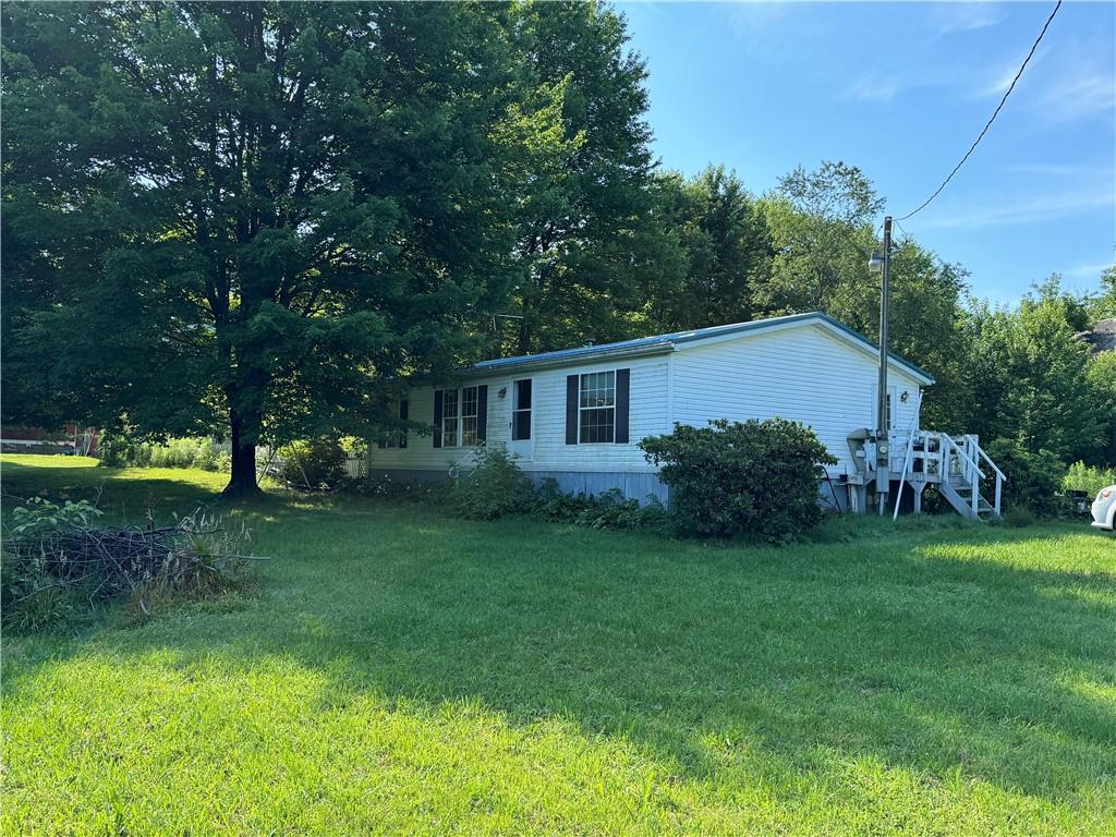 190 Cranberry Road Sandy Lake, PA 16145 - Photo 1 of 2 a house view with a garden space