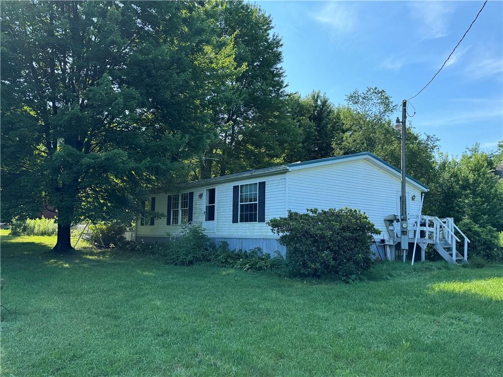 190 Cranberry Road Sandy Lake, PA 16145 - Photo 2 of 2 a view of backyard of house with green space