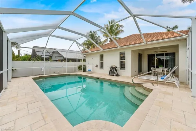 a view of a swimming pool with a patio