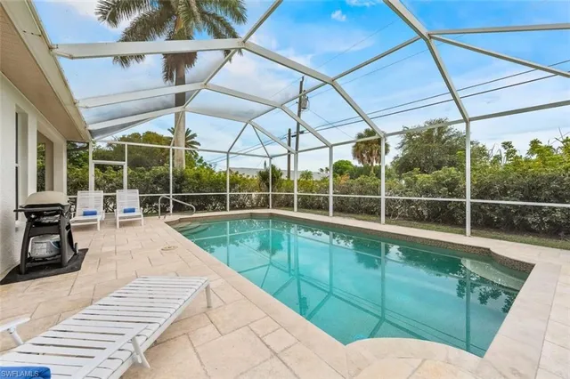 a view of a swimming pool with a patio