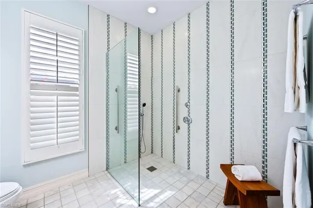 a bathroom with a shower and a toilet