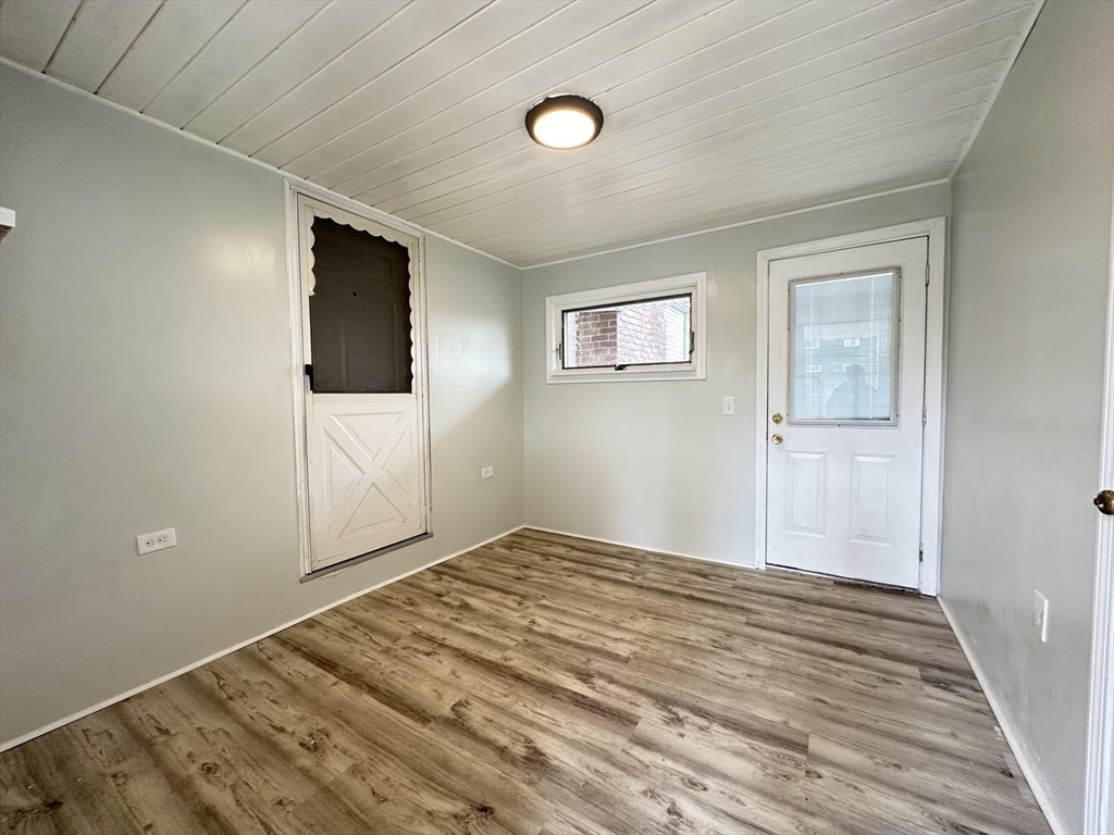 38 Hadley Street Springfield, MA 01118 - Photo 14 of 20 a bedroom with a bed and a flat screen tv