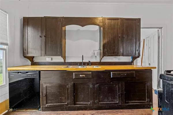 a view of a sink and a fireplace in a room