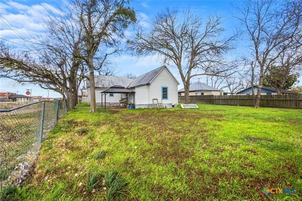 a house view with a garden space