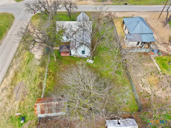 an aerial view of a house with a swimming pool